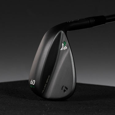 TaylorMade Milled Grind 4 Black Golf Wedges showing the back of the club head on a dark black background