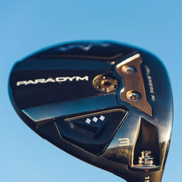 Callaway Golf Paradym Triple Diamond Fairway Wood held up so the sole of the club head is visible using the sky as a background