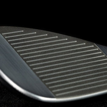 TaylorMade Milled Grind 4 Chrome Golf Wedge zoomed in to show the grooves on the face