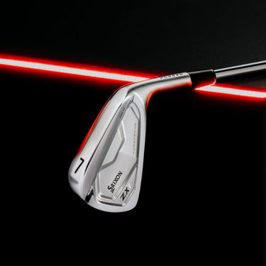 Srixon ZX7 7 Iron lying down on a red LED with a black background